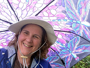 Laurie tries out her new Dragonfly umbrella in an unexpected California rain storm.