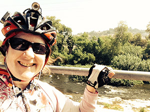 Laurie at the river in a bike helmut