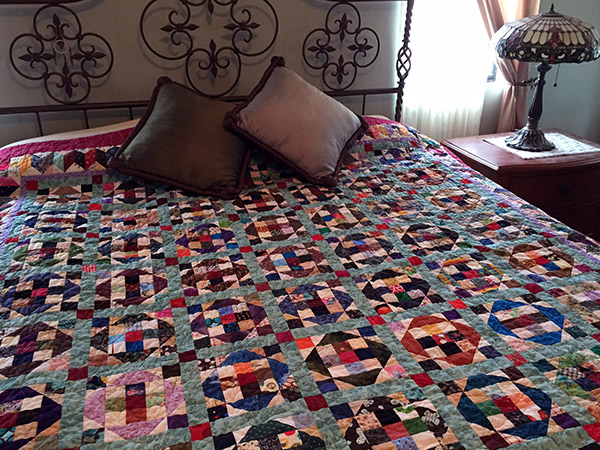 Colorful quilt on the bed
