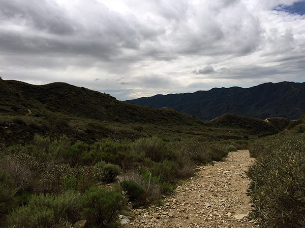 Stormy clouds over the foothills above the hiking path