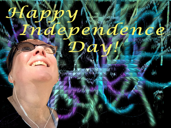 Laurie looking up at fireworks. Caption in photo says Happy Independence Day!