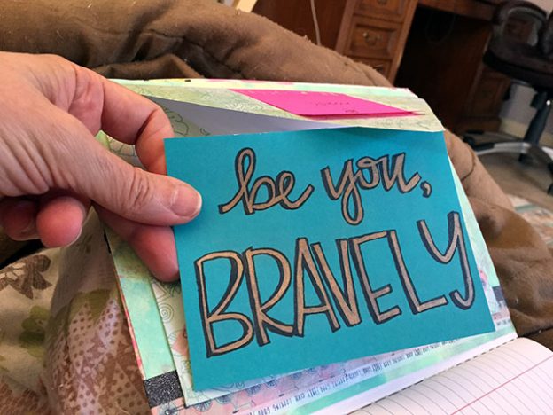 Close up of a hand made note that says be you, BRAVELY